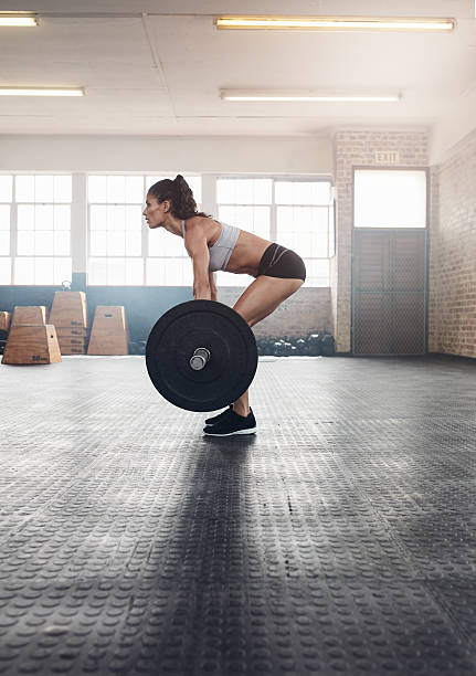 istock Fitness woman doing weightlifting exercise 599913012
