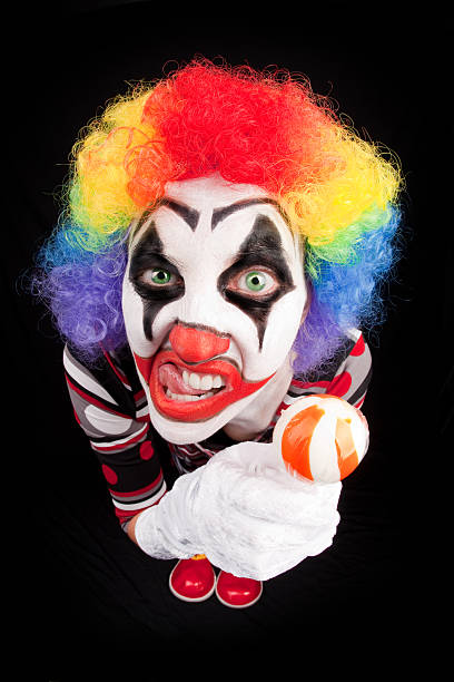 istock Fisheye Creepy CLown Holding Lollipop 599913332