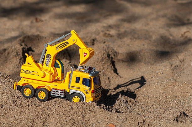 istock Toy excavator in the sand 599913886