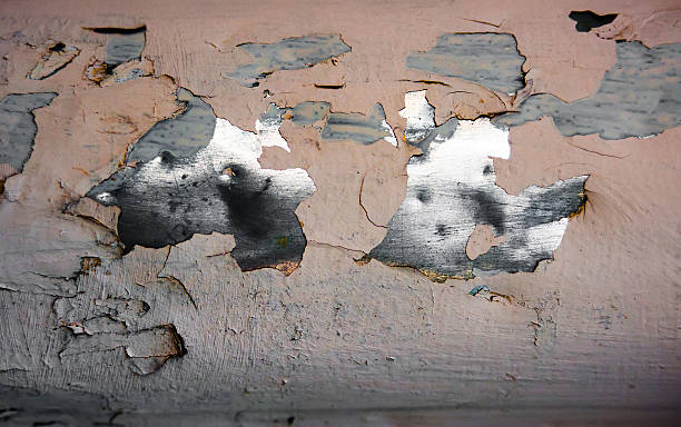istock chipped metal plating on scratched wall , grunge background 599914278