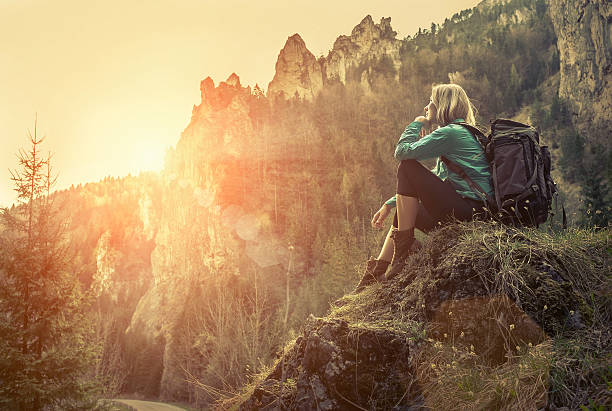 istock Woman hiking around mountains at spreeng time. 599921136