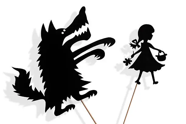 Little Red Riding Hood and the Big Bad Wolf shadow puppets and their shades on white background