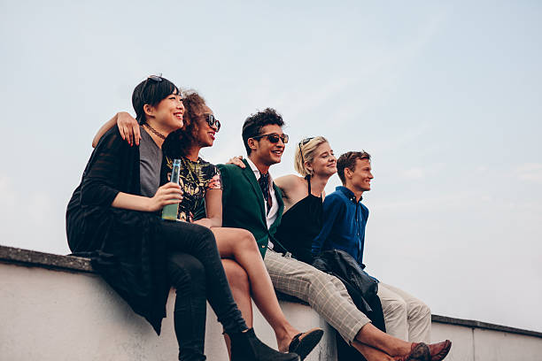 istock Multiethnic friends relaxing on terrace 599922844
