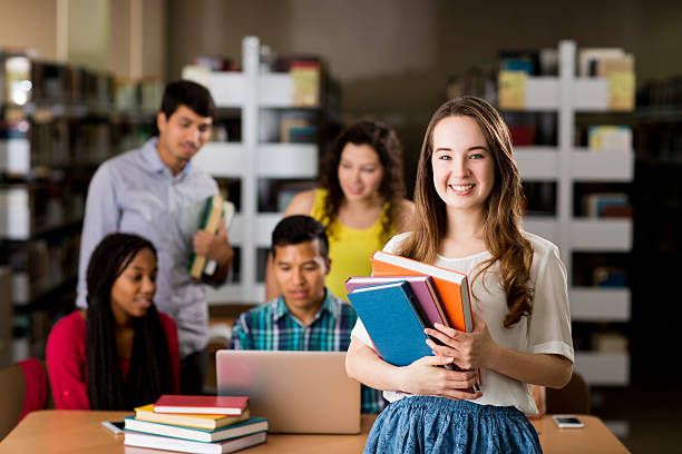 istock American college student holding books and smiling 599922894