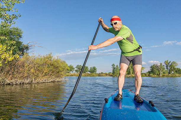 istock senior male paddler on paddleboard 599923290