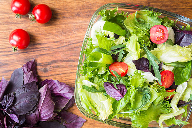 istock Green summer salad with cherry tomatos 599923668