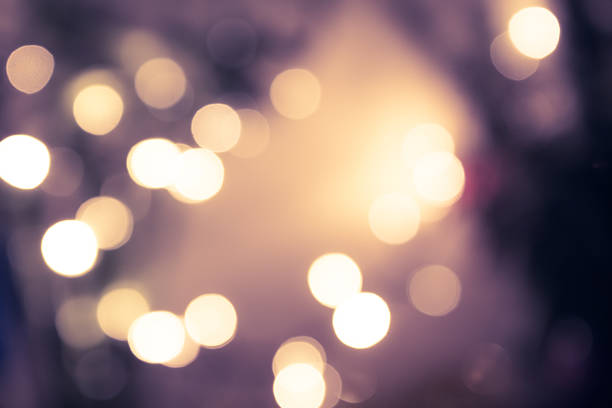 Vintage blue toned bokeh with blurred sparkling christmas lighting