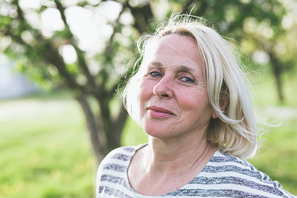 istock Senior woman in park 599952344