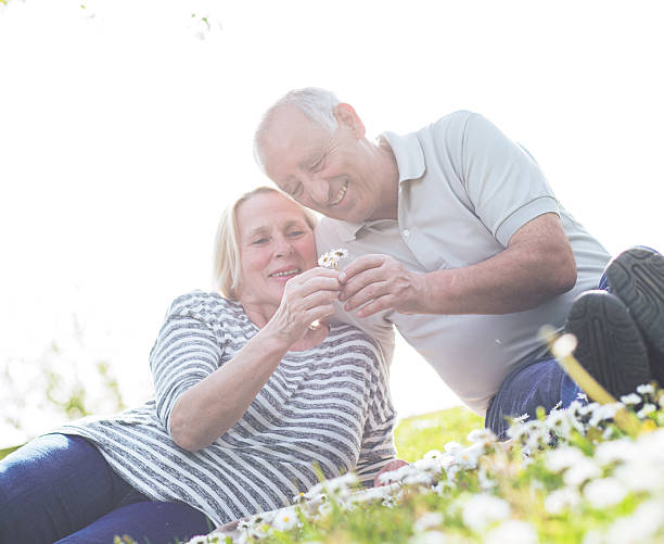 istock Smiling senior couple in park 599952408
