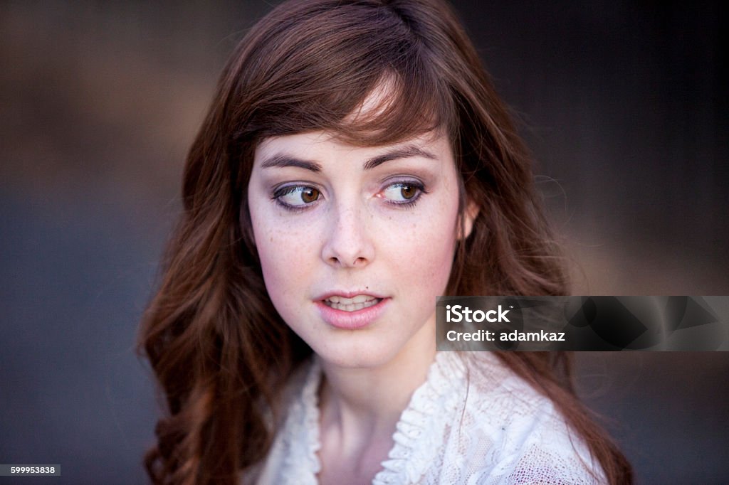 Attractive Young Woman Portrait of an attractive young brunette caucasian woman Bangs - Hair Stock Photo