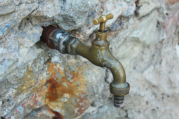 istock tap stuck in the rocks 599953946