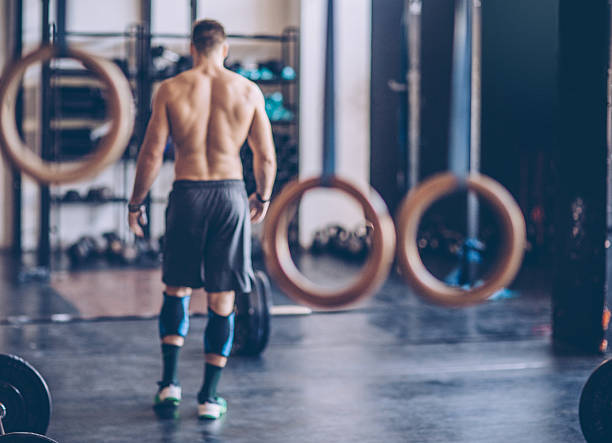 Be proud, but never satisfied. Young athlete preparing for exercise deadlift in gym. Professional athlete. Wearing sports clothing. crossfit chalk weightlifting weight training stock pictures, royalty-free photos & images