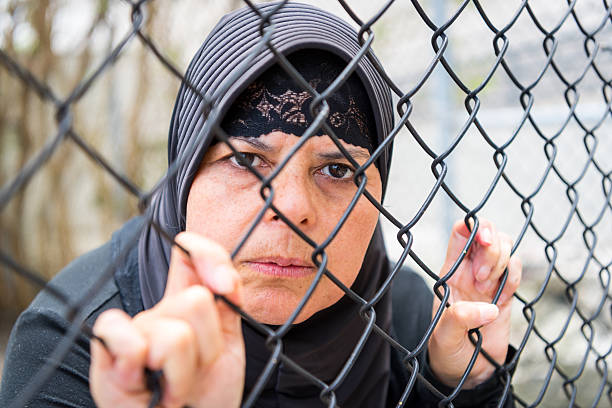 istock Sad refugee Middle eastern woman (Real People) 599954660