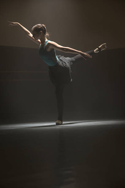 istock Posing ballerina in the class room 599957916