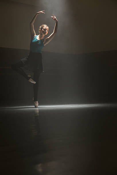 istock Posing ballerina in the class room 599958094