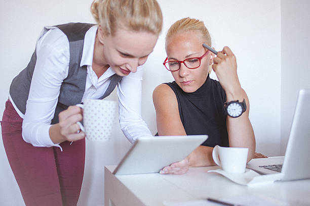 istock Two young women working together from home office 599958632