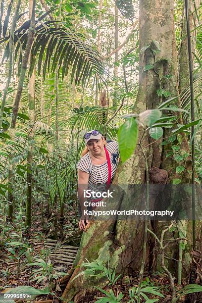 Happy Woman Standing Next To A Kapok Tree Stock Photo - Download Image Now - Adult, Adventure, Amazon Region