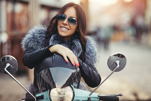 istock Young modern woman on motorcycle 599959350