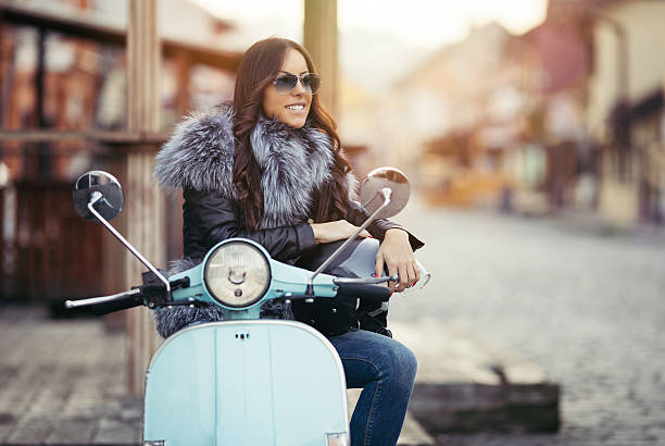 istock Young modern woman on motorcycle 599959410