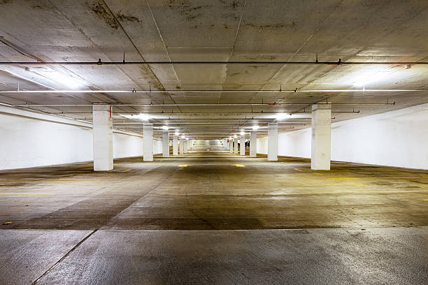 istock Large grungy empty undercover parking area 599962258