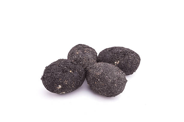 istock Close up salted egg cover by black rice husk isolated 599965630