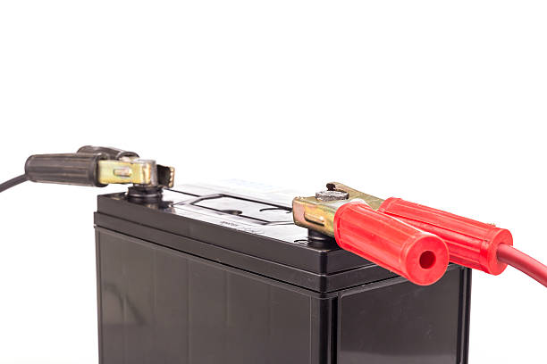 istock Car battery with jump start isolated on white background 599968982