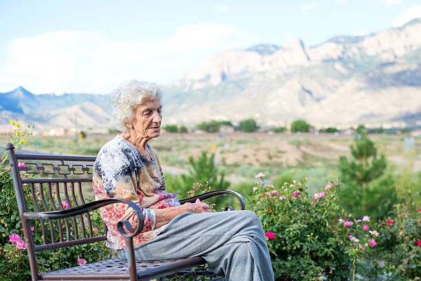 Senior Woman Outside on Bench, Lonely