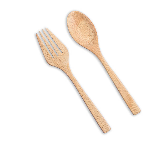 istock Top view bright wooden spoon and fork isolated on white 599970414