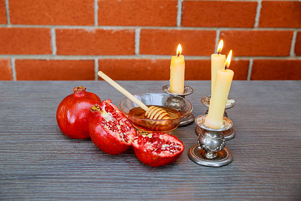 istock rosh hashanah honey, apple and pomegranate 599970764