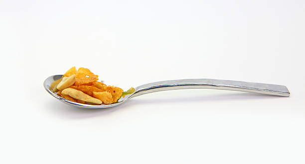 istock cereal with cashew nut and kiwi in a stainless spoon 599972438