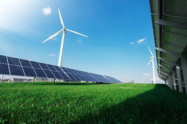 istock Windmill and solar panels on blue sky at daytime 599972538
