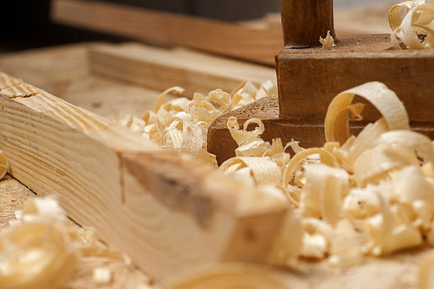 istock Carpenter working. tools on wooden table with sawdust. 599975888