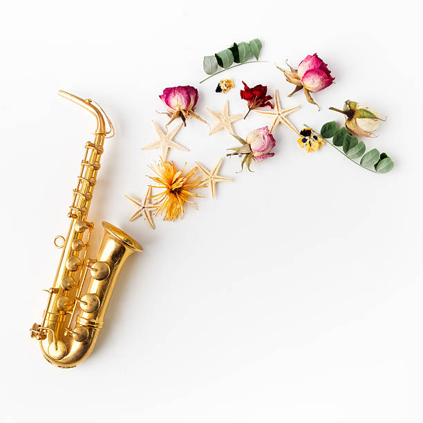 istock Jazz Day. Saxophone with flowers. Flat lay, top view 599977902