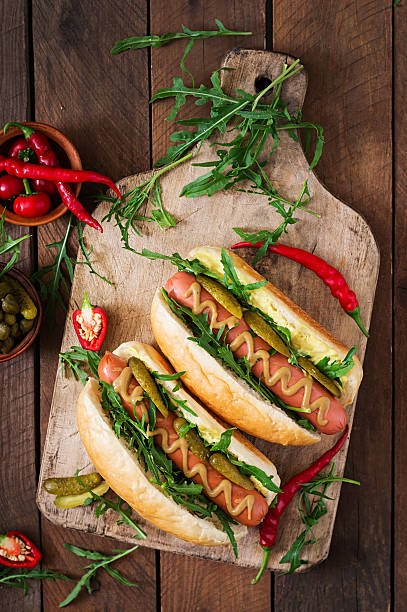 istock Hot dog with pickles, capers and arugula 599978064