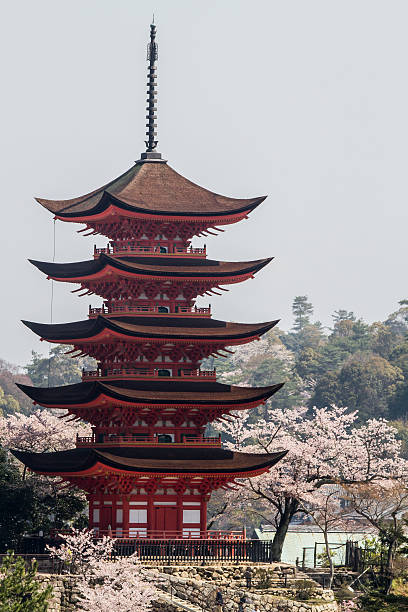 Hatsukaichi, Hiroshima Prefecture, Japan- April 12, 2012: Five-story pagoda in the spring, a UNESCO World Heritage Site Itsukushima Shrine.
