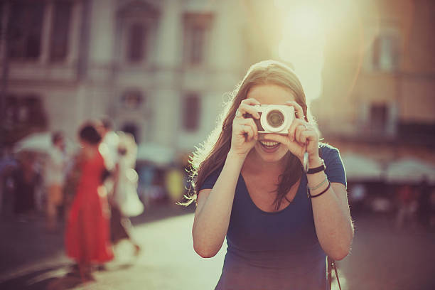 Tourist woman photographing with digital camera  in Rome Tourist woman photographing with digital camera  in Rome point and shoot camera stock pictures, royalty-free photos & images