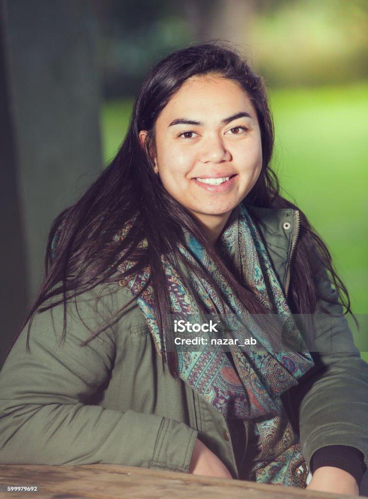 Smiling Maori Woman. A young Maori woman in an outdoor setting looking at camera and smiling. Australia Stock Photo