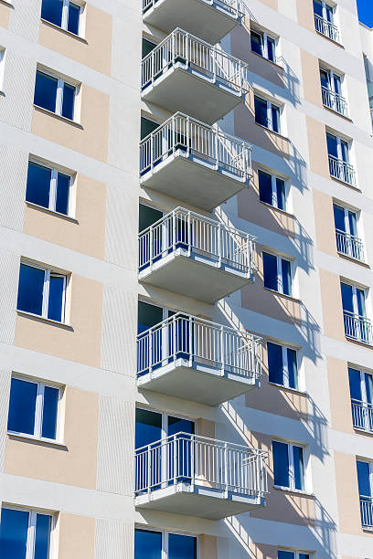 istock Balconies in white modern apartment building 599982388
