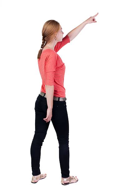 istock Back view of  pointing woman. 599983728