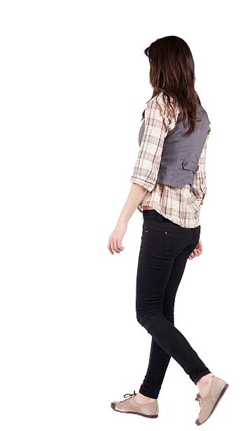 istock back view of walking woman . 599983778
