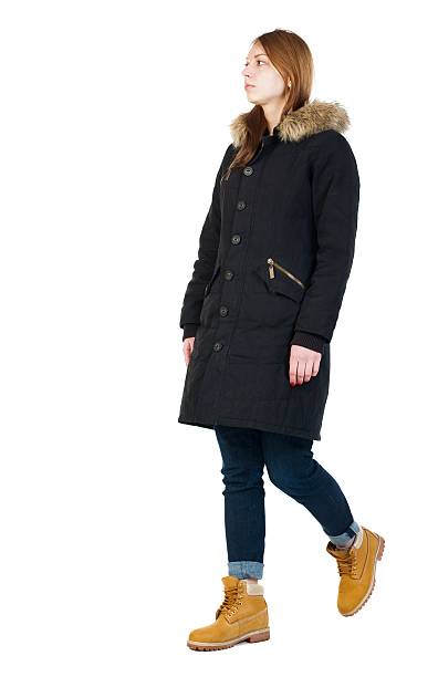 istock Back view of going  woman in parka. 599984038