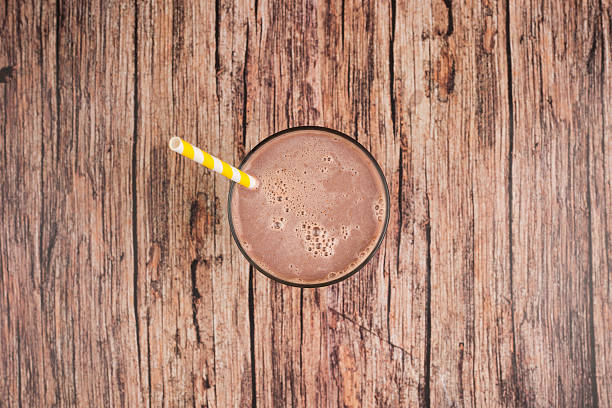 Chocolate and chocolate milkshake on wooden tableChocolate and chocolate milkshake on wooden table