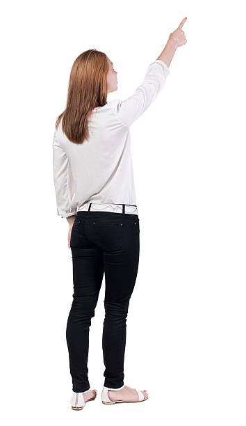 istock Back view of  pointing woman. 599984642