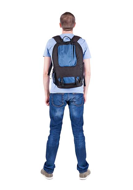 istock Back view of man with  backpack looking up. 599985622