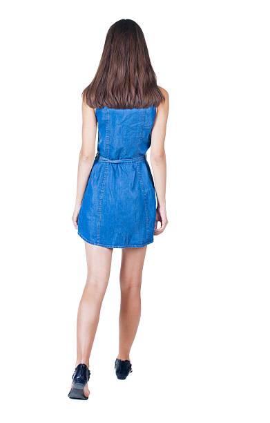 istock back view of walking woman . 599986628