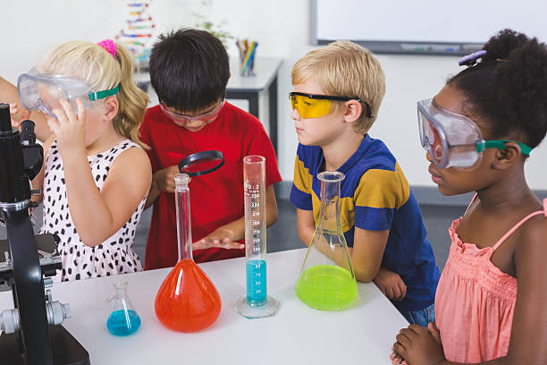 istock Kids doing a chemical experiment in laboratory 599987526