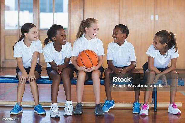 School Kids Having Fun In Basketball Court Stock Photo - Download Image Now - Physical Education, Child, School Uniform