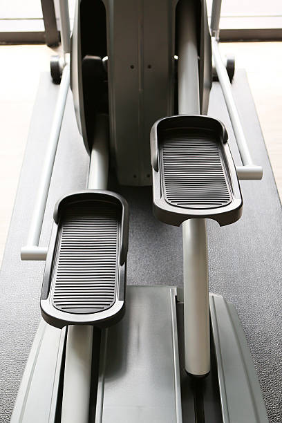 istock Elliptical cross trainer machine in exercise room for sport 599989168