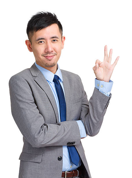 istock Young Chinese giving the ok sign 599989622