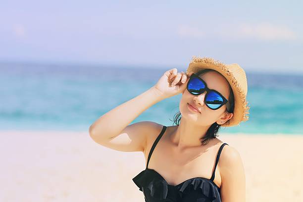 istock Young beautiful woman on the beach 599991310